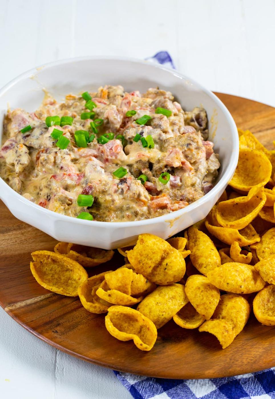 Dip in a bowl surrounded by Frito scoops.