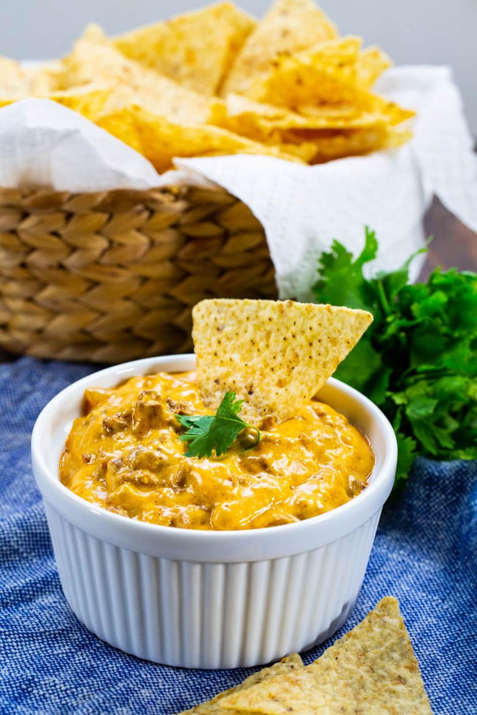 Slow Cooker Enchilada Dip in a white bowl.