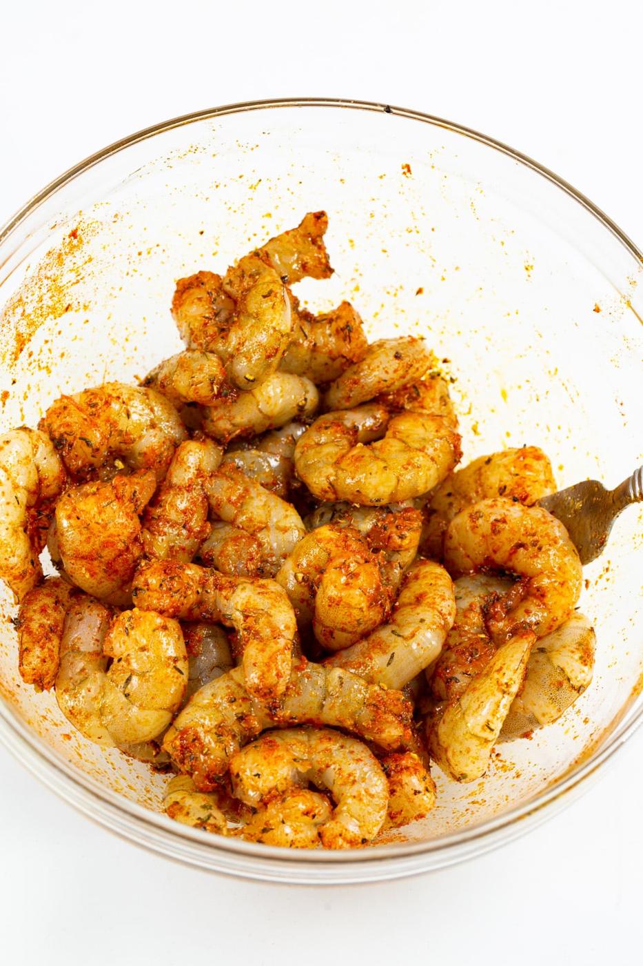 Raw shrimp coated in seasonings.