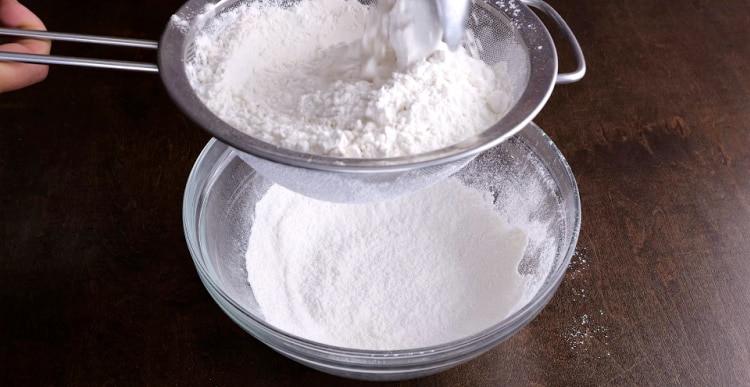 Sifting dry ingredients.