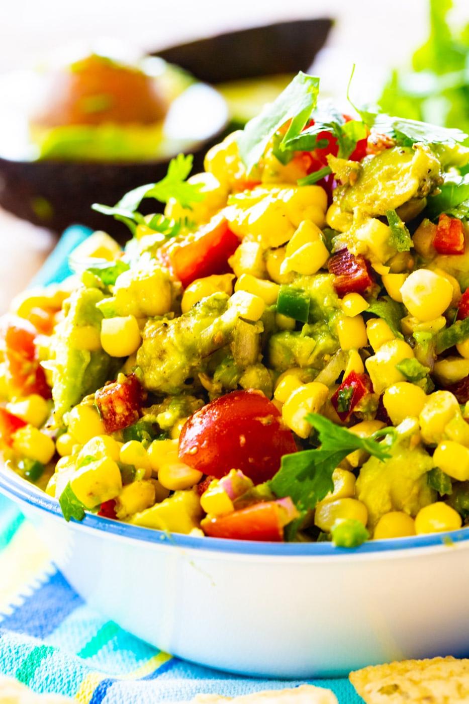 Avocado and Corn Salsa piled high in a bowl.