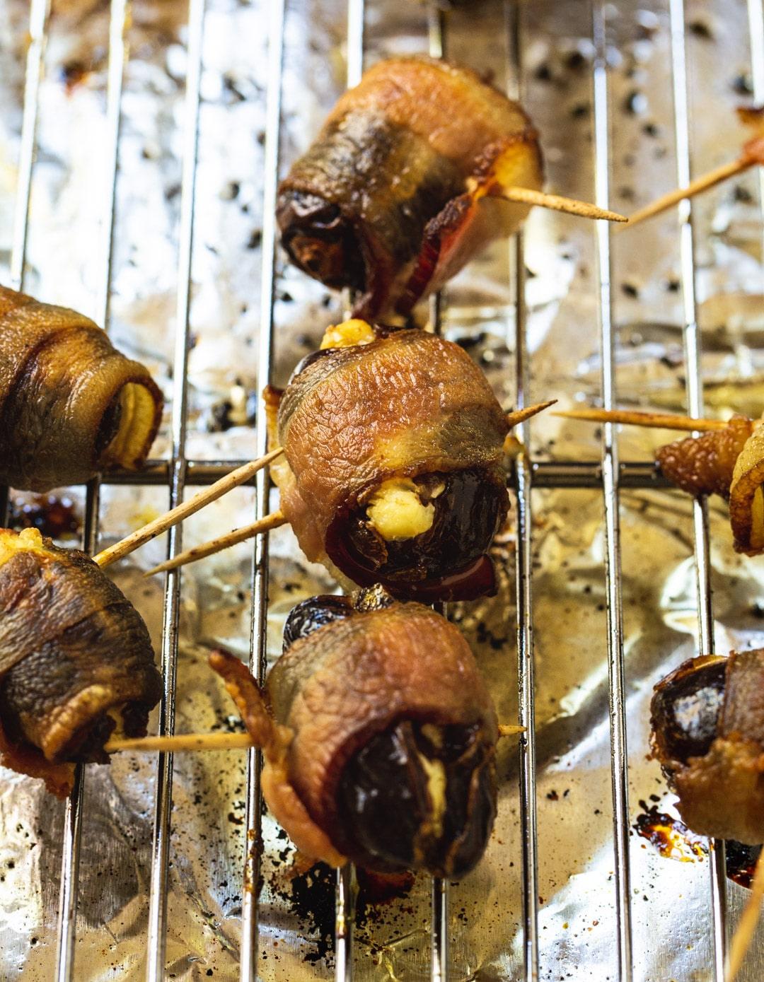 Cooked dates on a wire rack.