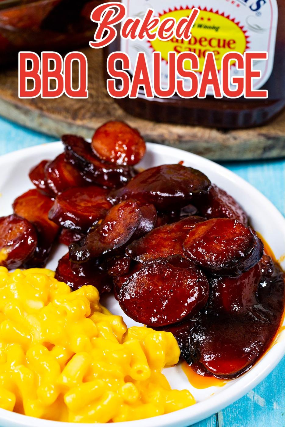 Baked BBQ Sausage on plate with mac and cheese.