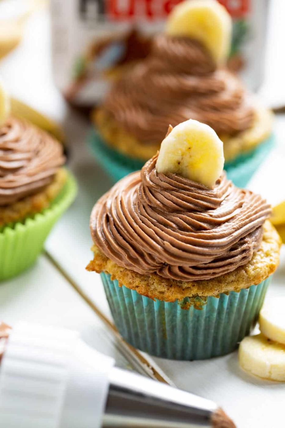 Cupcake and piping bag with frosting.