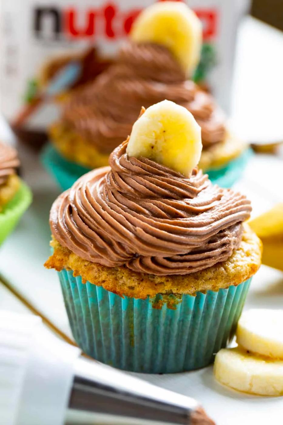 Banana Cupcakes with Nutella Frosting topped with a banana slice.