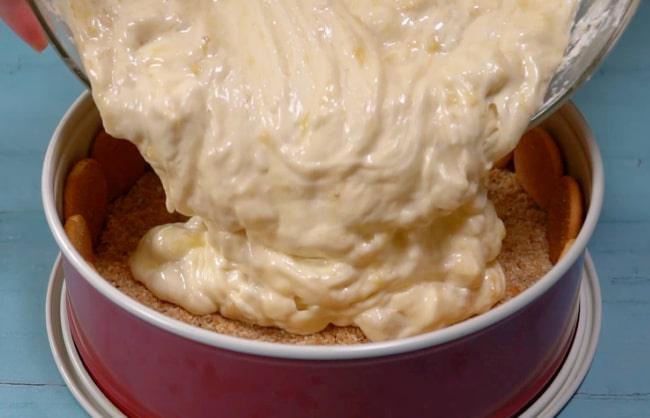 Pouring batter into pan.