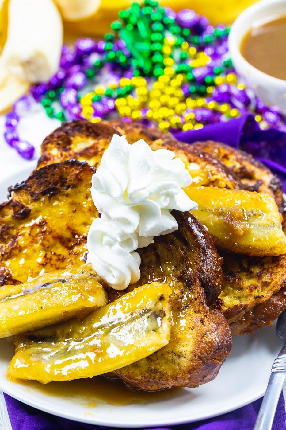 Bananas Foster French Toast topped with whipped cream.