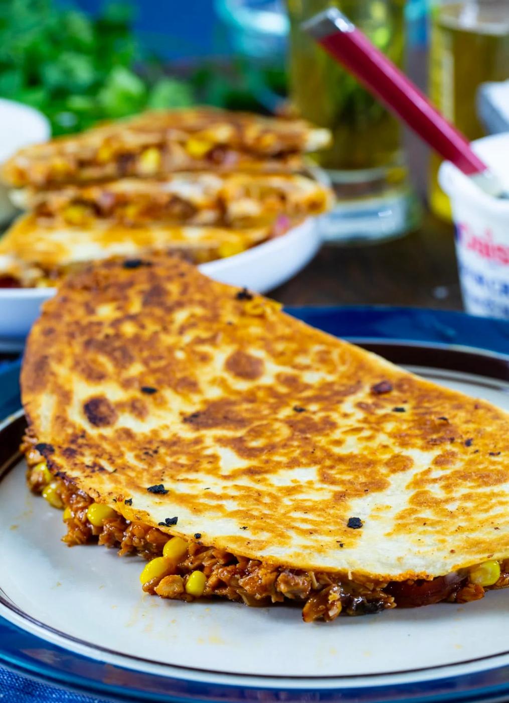 Whole quesadilla on a plate.