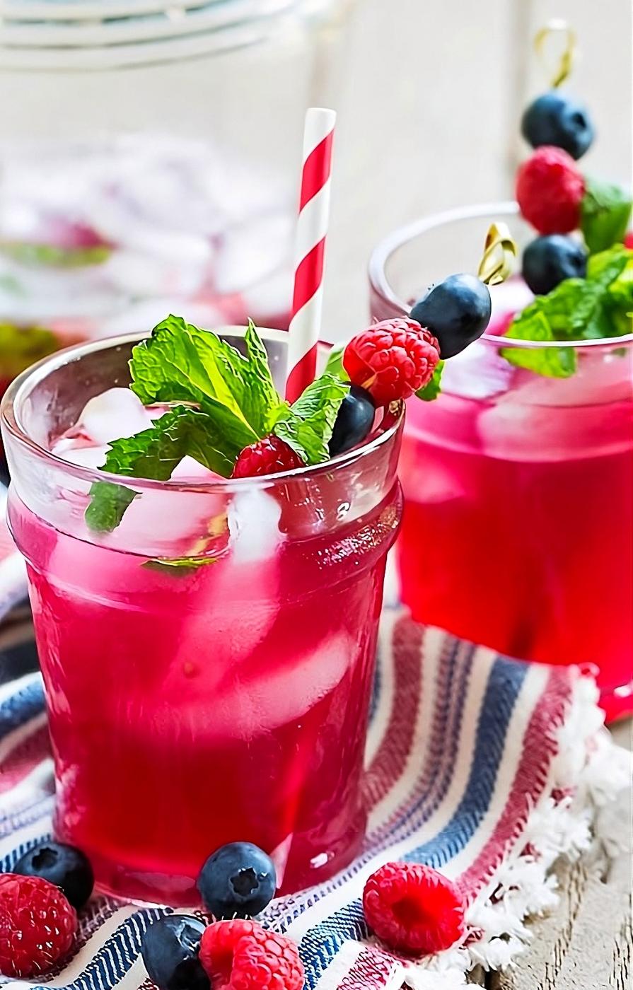 Berry Mijitos in 2 cocktail glasses.