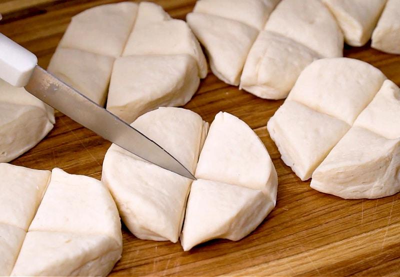 Cutting biscuits into fourths.