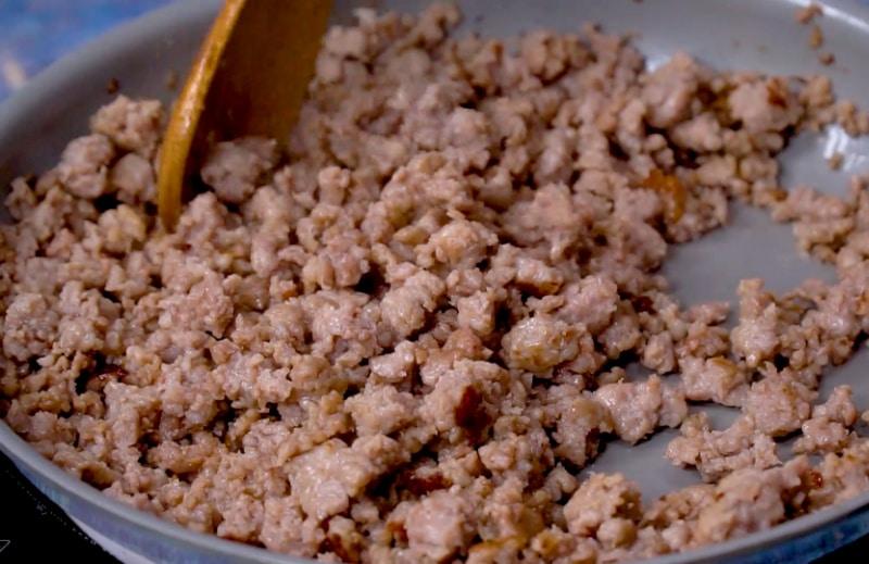 Browning sausage in pan.