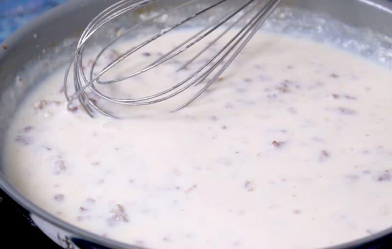 Sausage gravy mixture in pan.