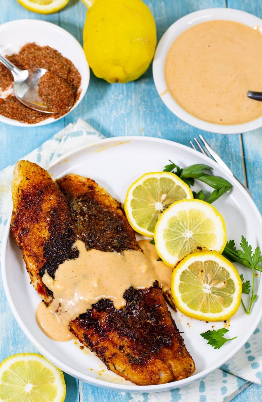 Blackened Catfish covered with Comeback Sauce on a plate.
