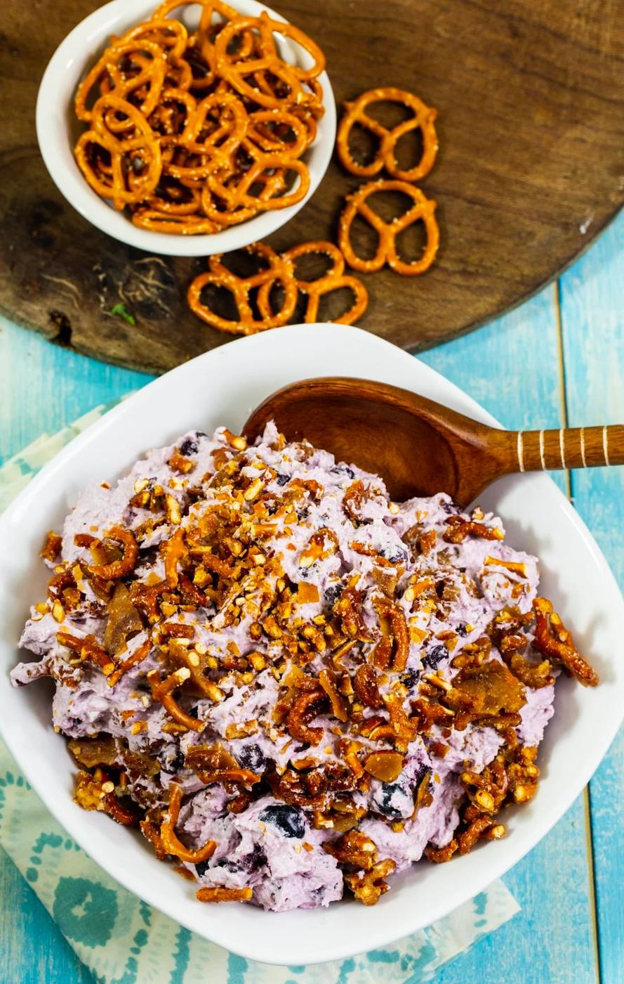 Pretzel Fluff with Blueberries and pretzels in a small bowl.