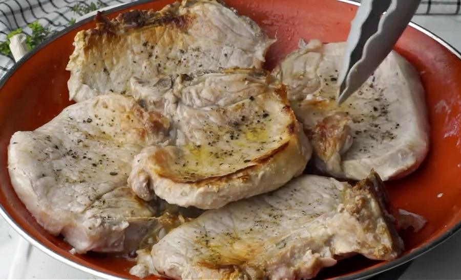 Searing the pork chops.