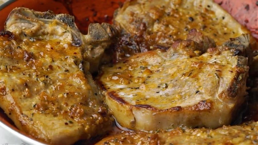 Finished pork chops in pan.