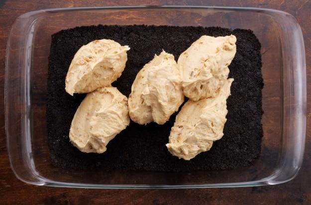 Spreading the peanut butter layer.