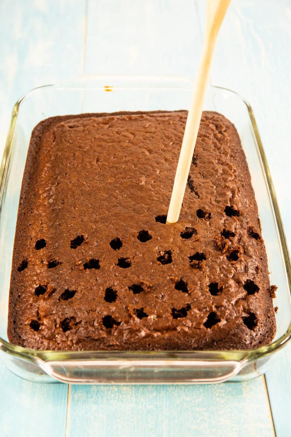 Holes getting poked in cake.