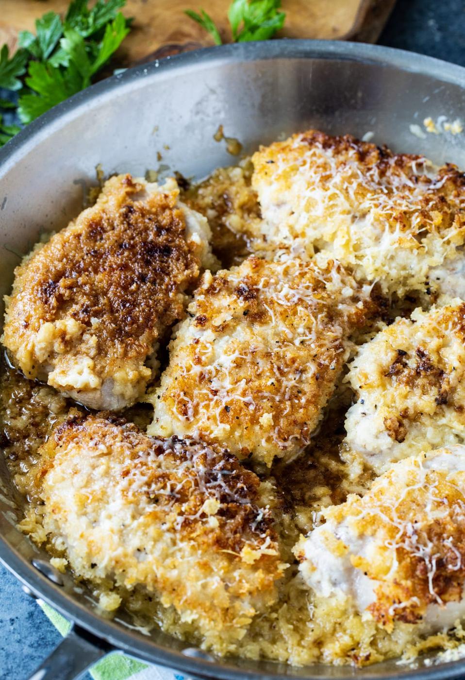 Pork Chops in a skillet.