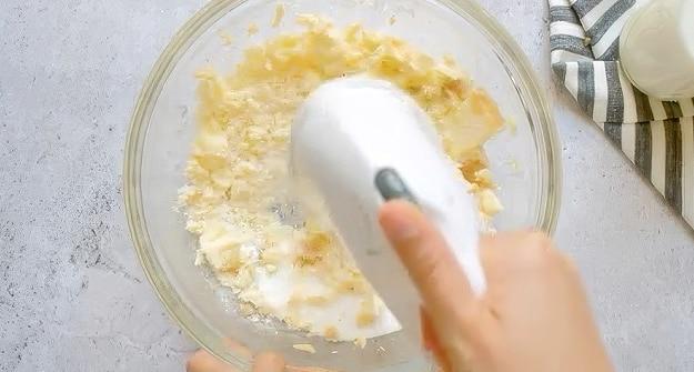 Beating butter and sugar.