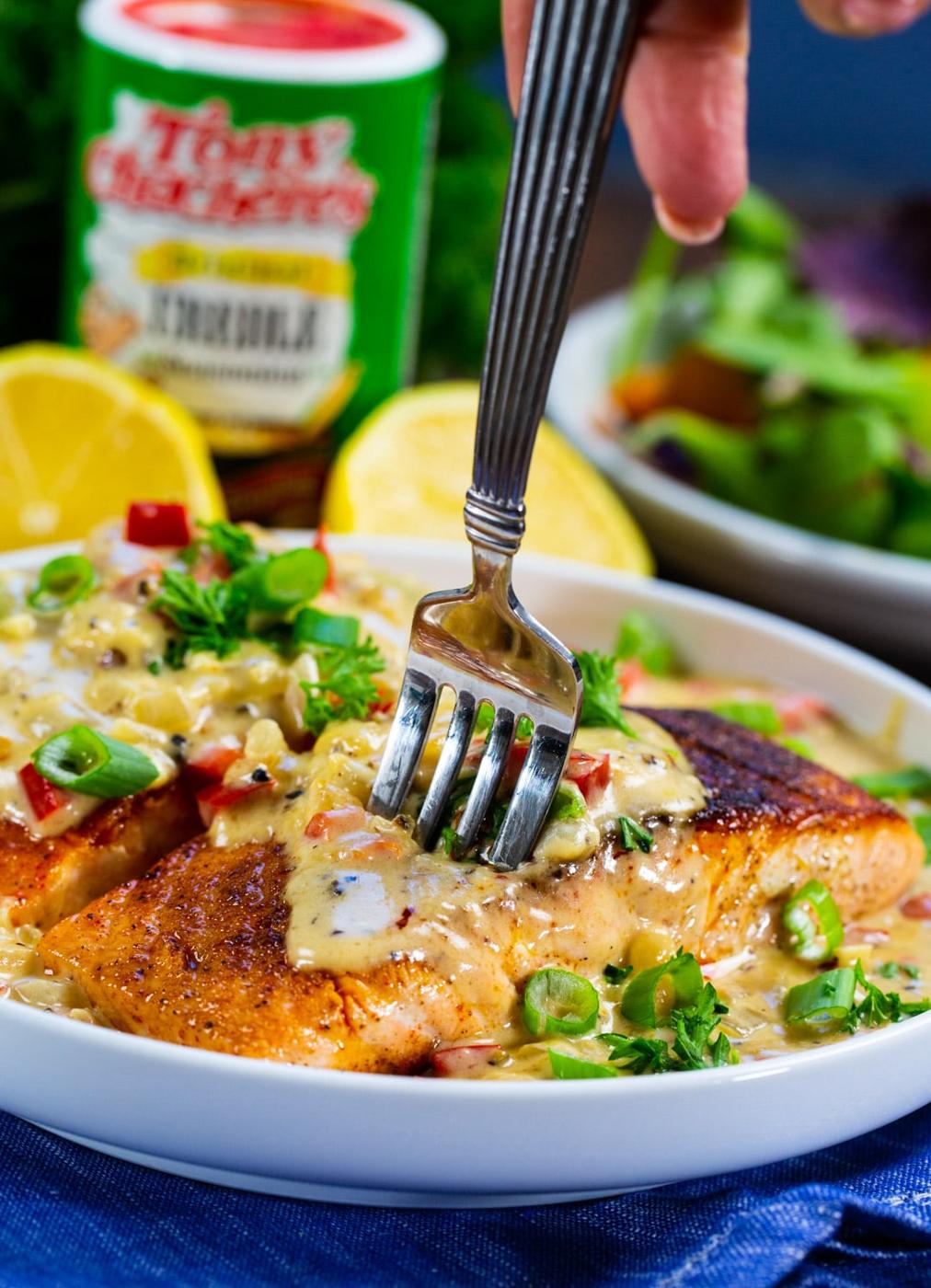 Fork stuck into salmon.