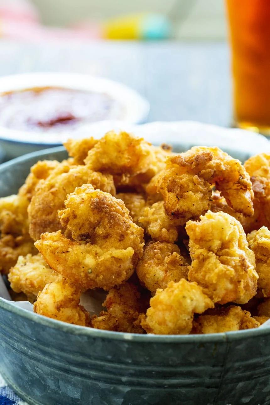 Fried Calabash Shrimp with beer in background.