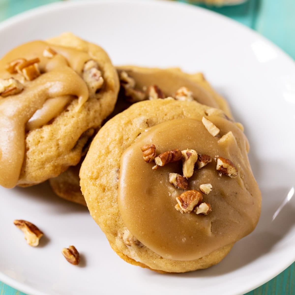 Caramel Frosted Brown Sugar Cookes on a plate.