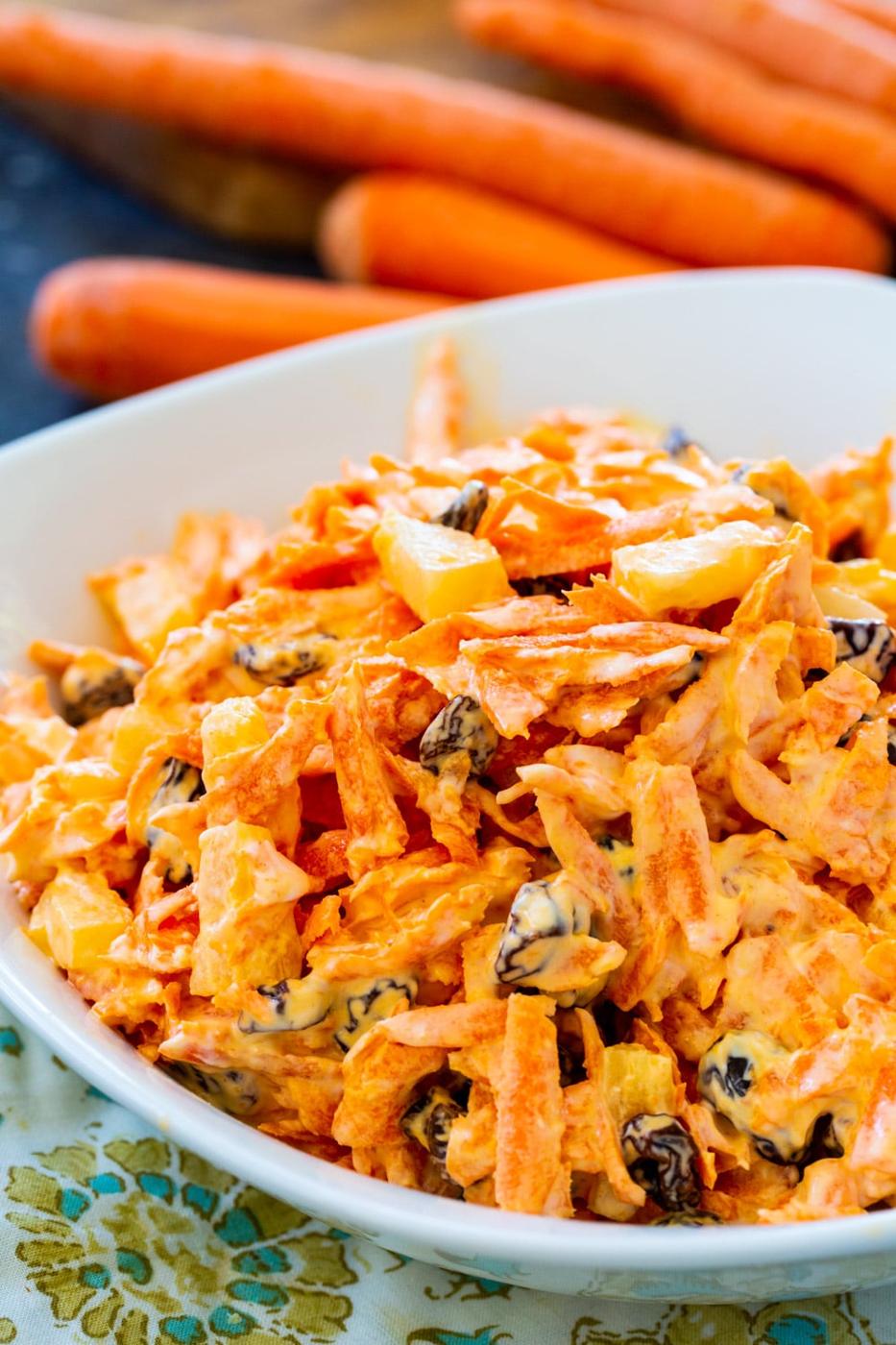 Carrot Raisin Salad in a white serving bowl.