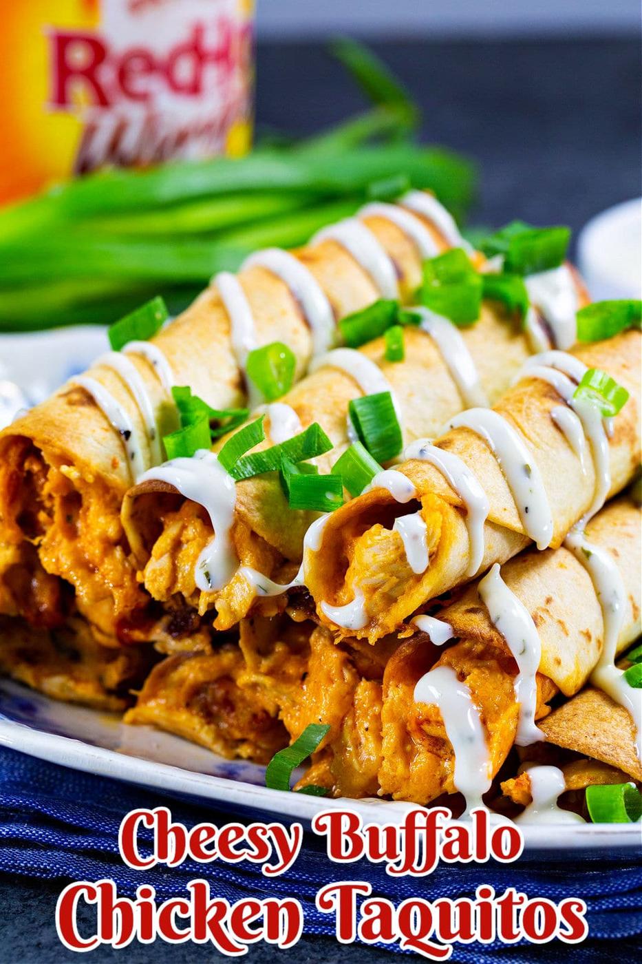 Cheesy Buffalo Chicken Taquitos piled on a plate.