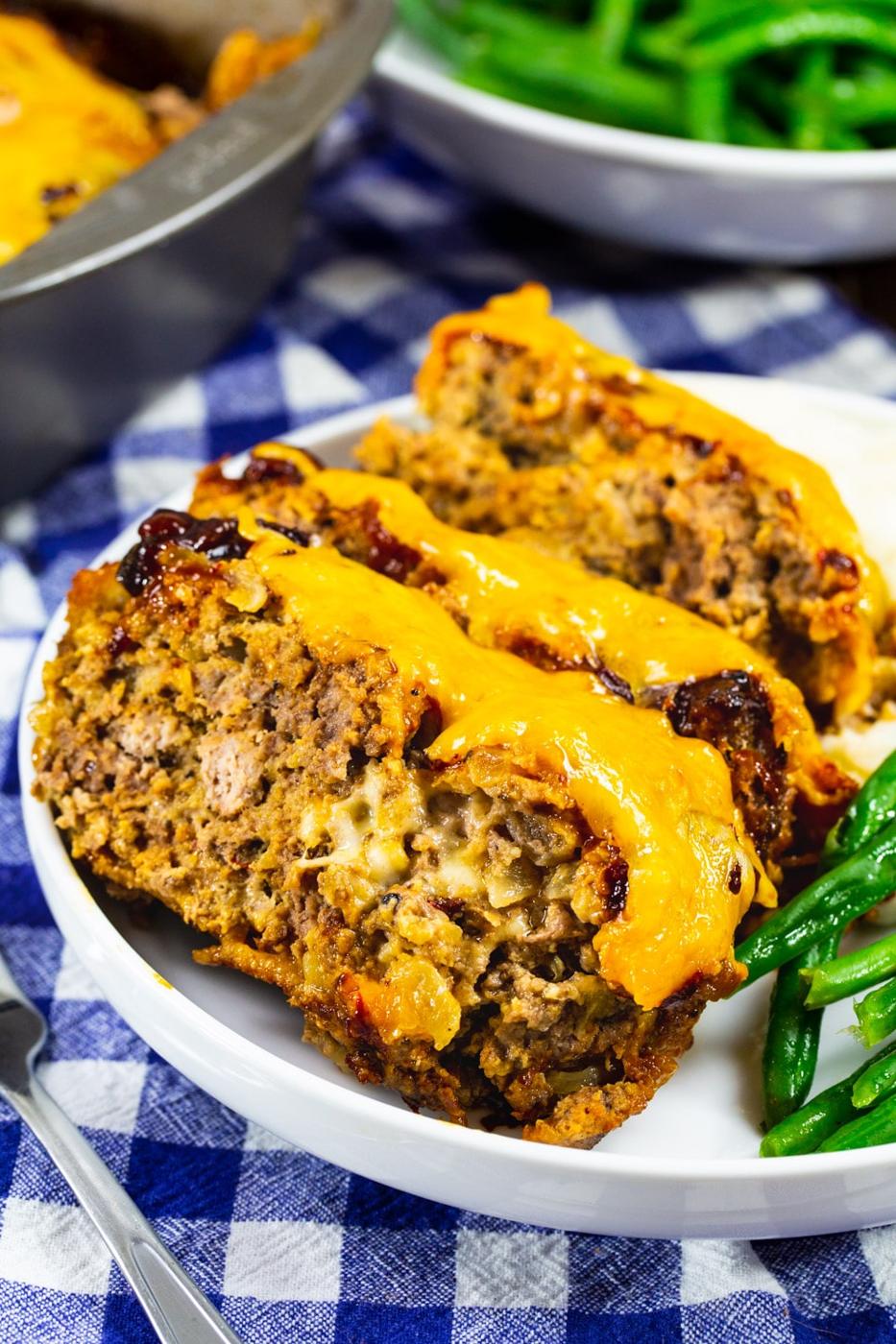 Three slices of Cheesy Chipotle Meatloaf on a plate.