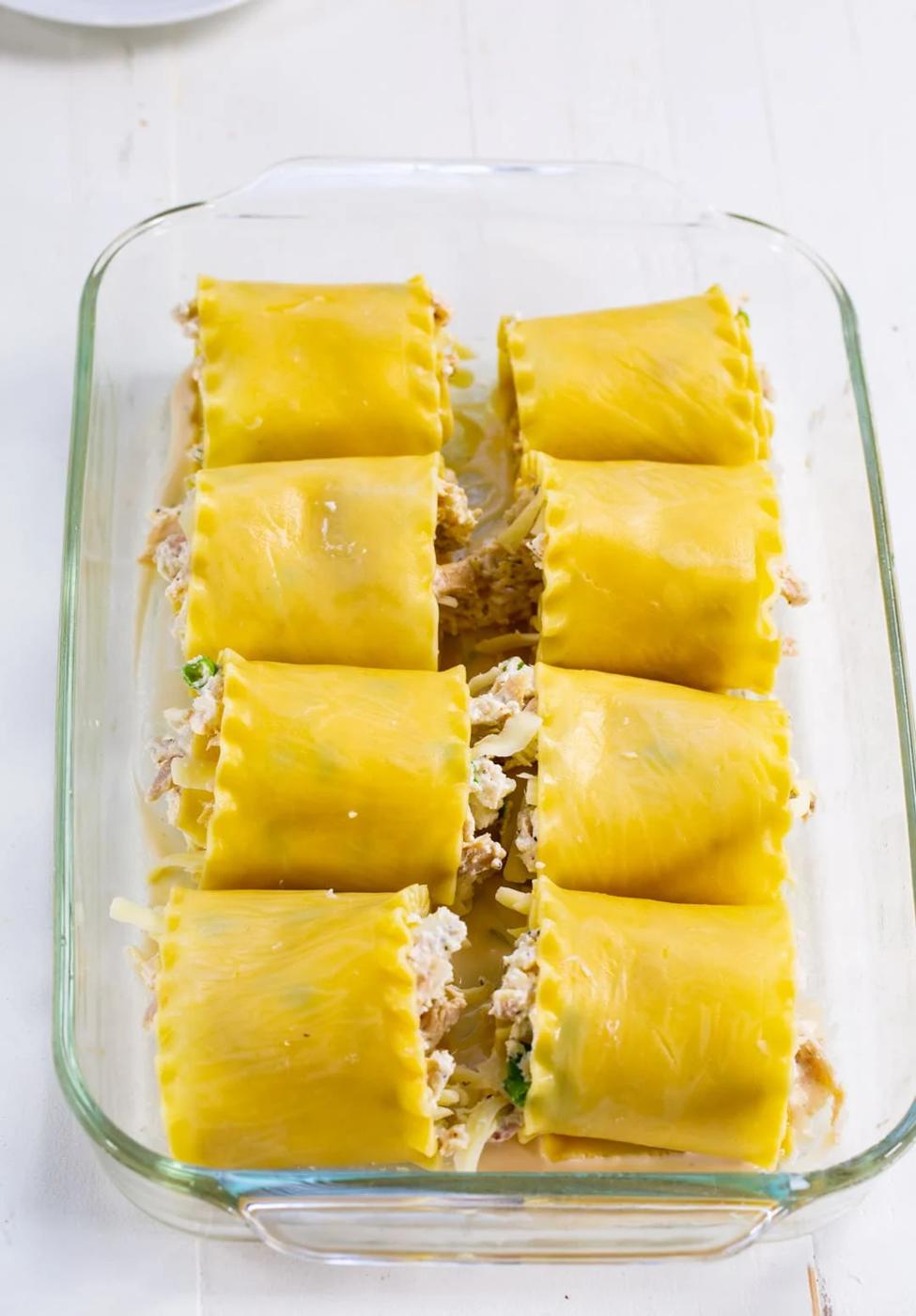 Unbaked roll-ups placed in baking dish.