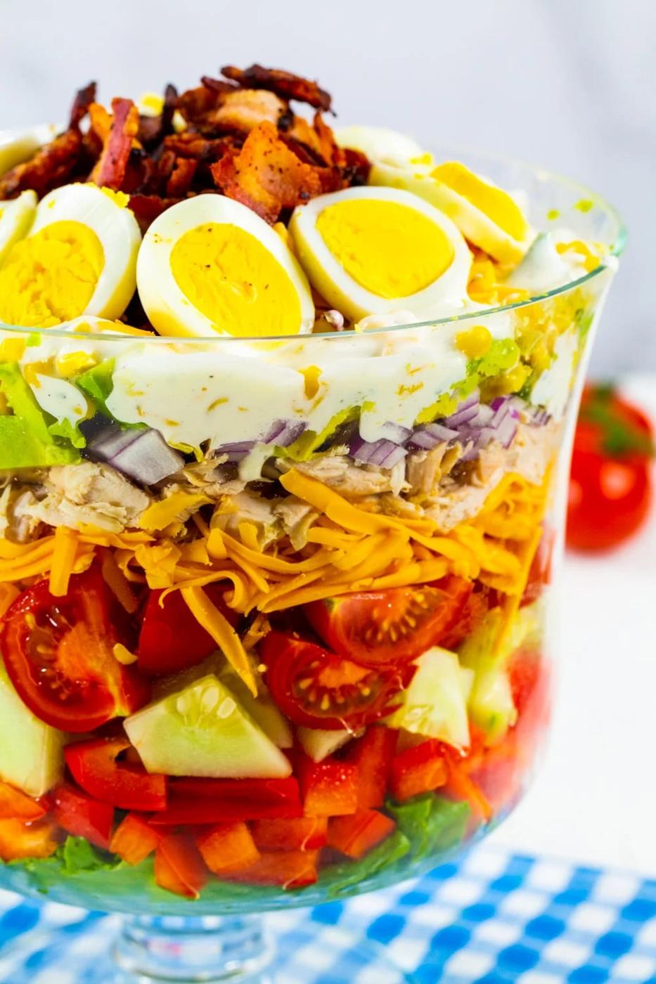 Chicken Bacon Ranch Layer Salad in a glass trifle bowl.