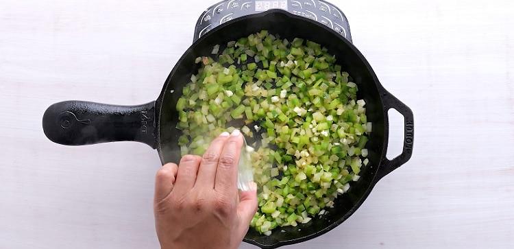 Adding garlic.