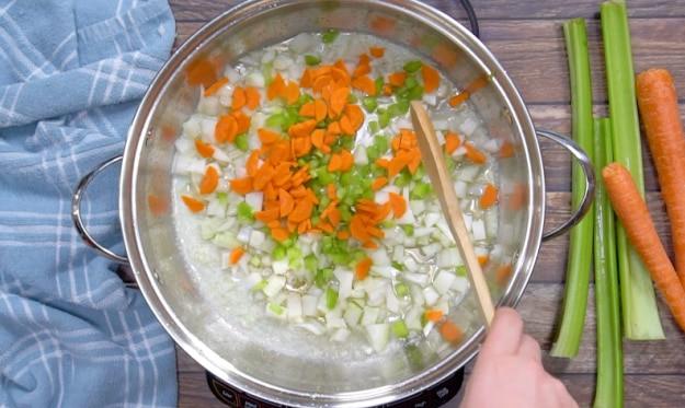 Cooking the carrots, onion, and celery.