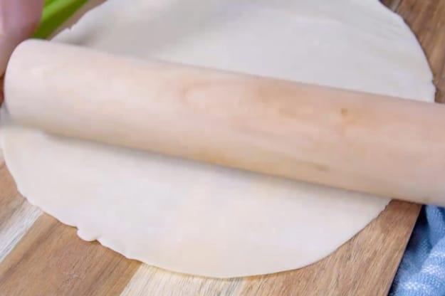 Rolling out the dough.