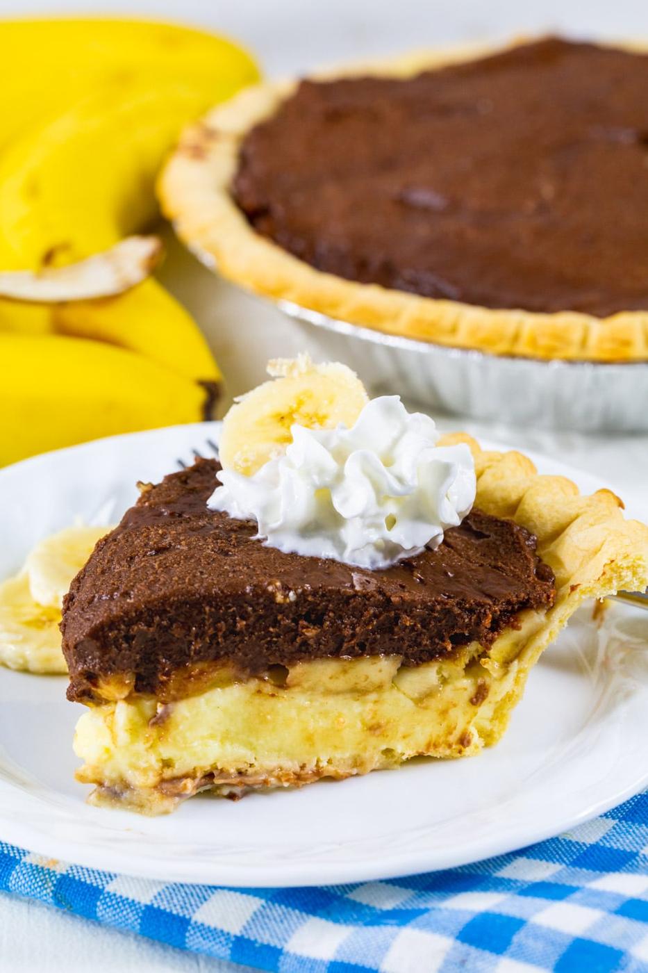 Slice of Banana Cream Pie with Chocolate on a plate.