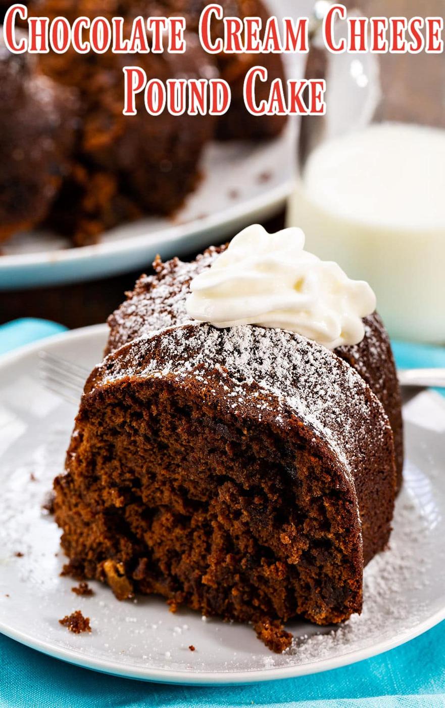 Slice of Chocolate Cream Cheese Pound Cake topped with whipped cream.