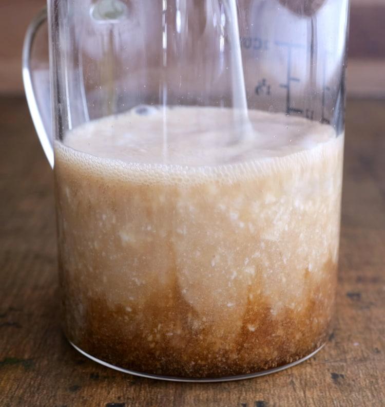 Buttermilk and coke in measuring cup.