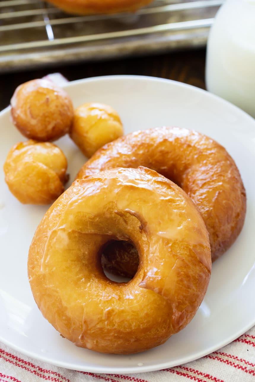Doughnuts and doughnut holes on a plate.
