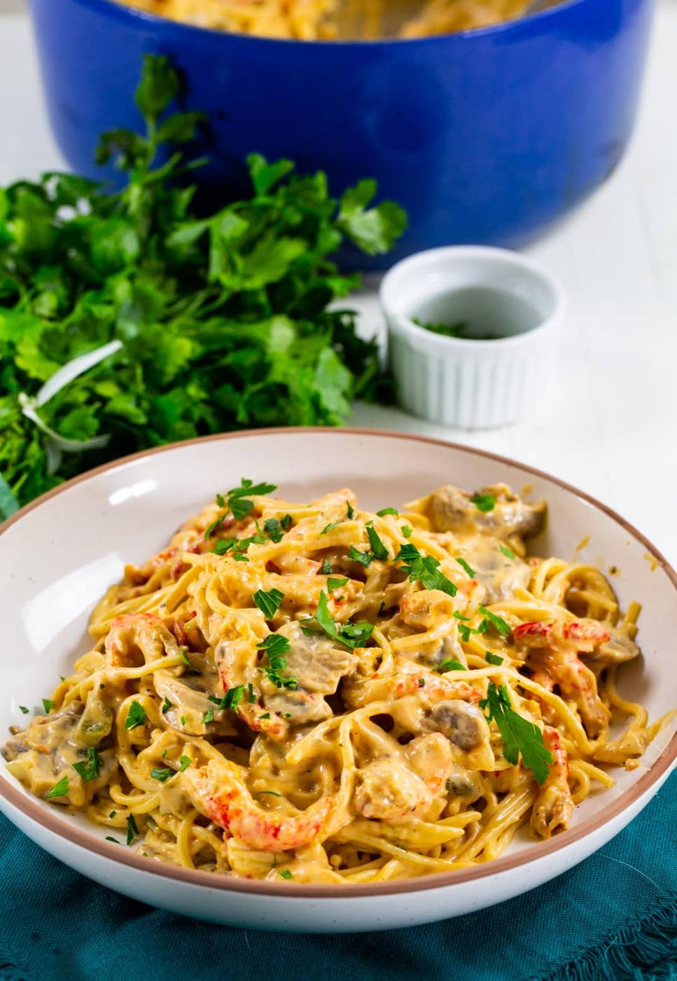 Tetrazzini with crawfish in a serving bowl.
