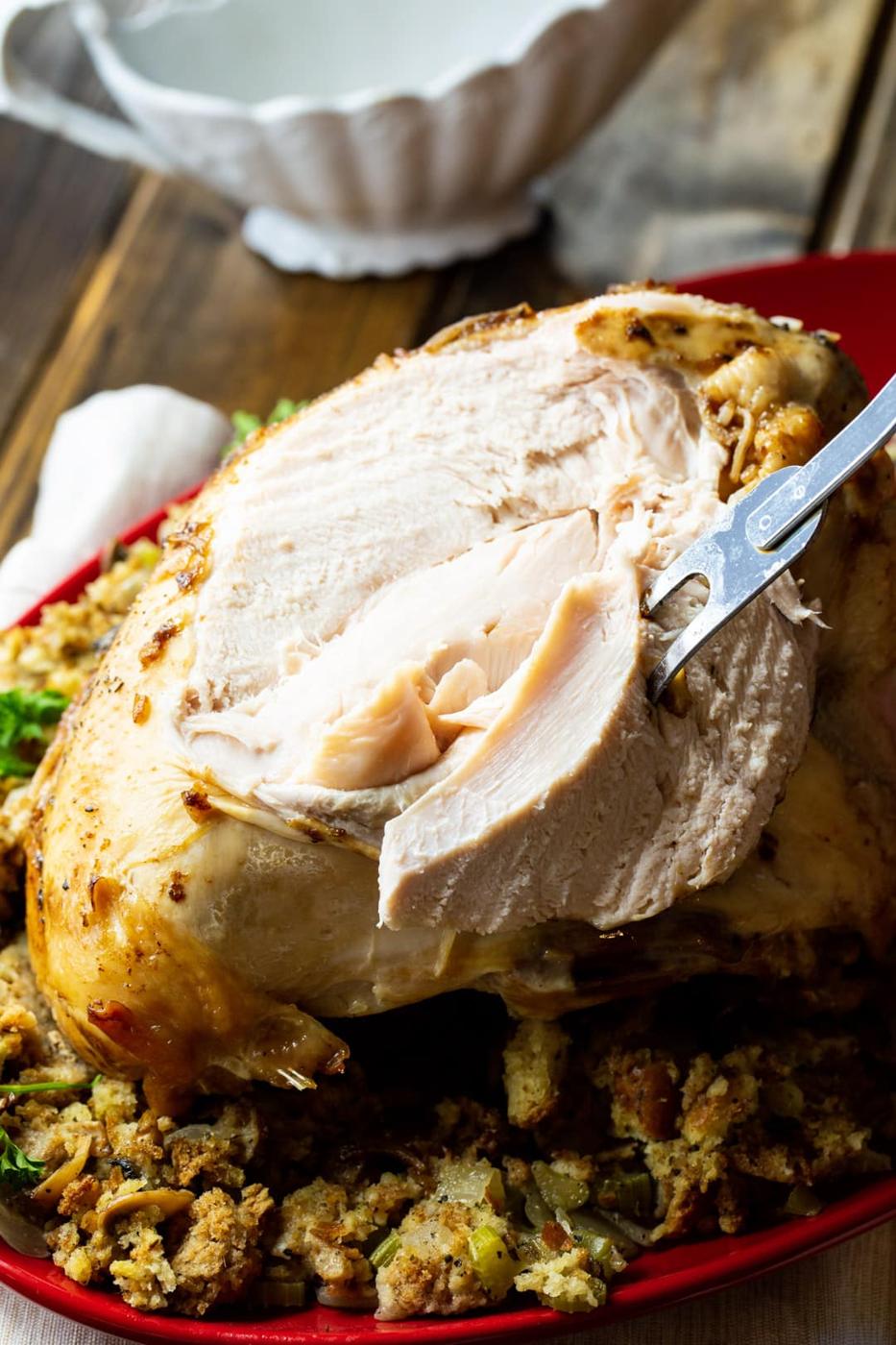 Turkey breast with a slice removed.