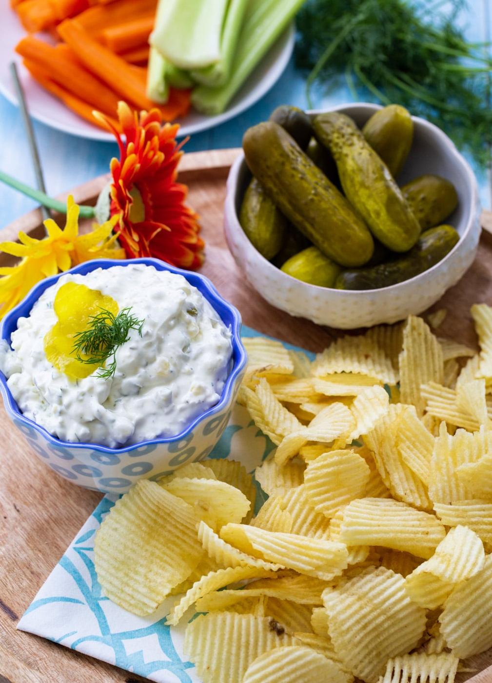 Pickle Dip in a bowl surrounded by chips.