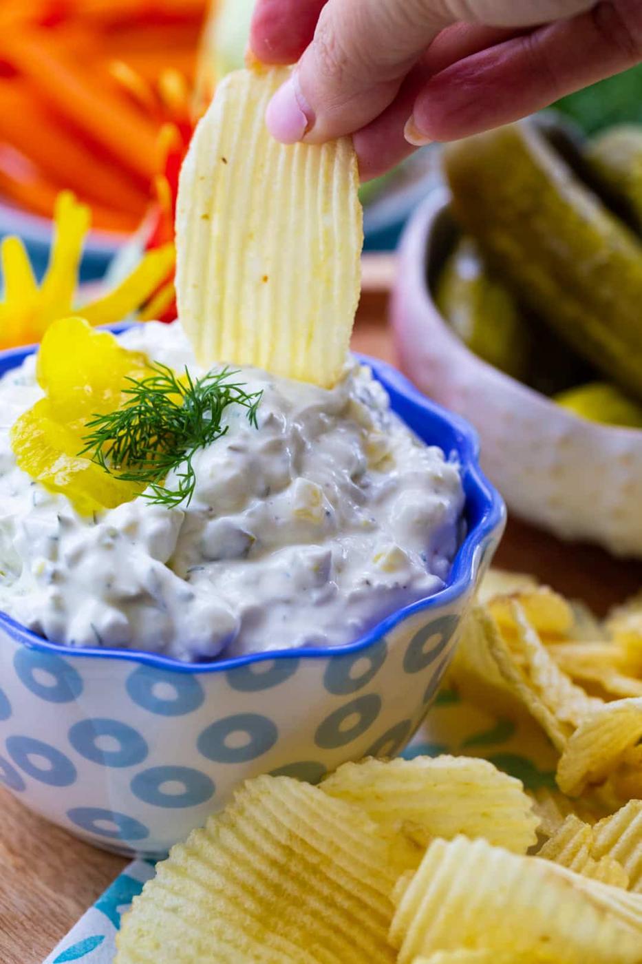 Chip being dipped into dip.