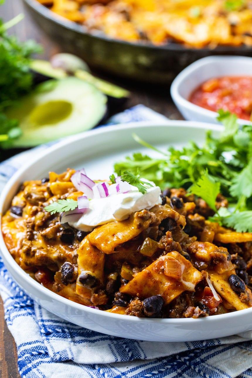 A sering of Beef Burrito Skillet on a white plate with cilantro.
