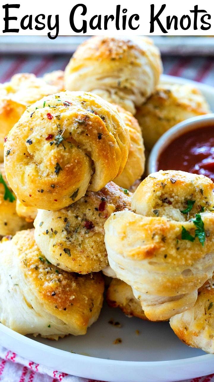 Garlic Knots piled up on a plate.
