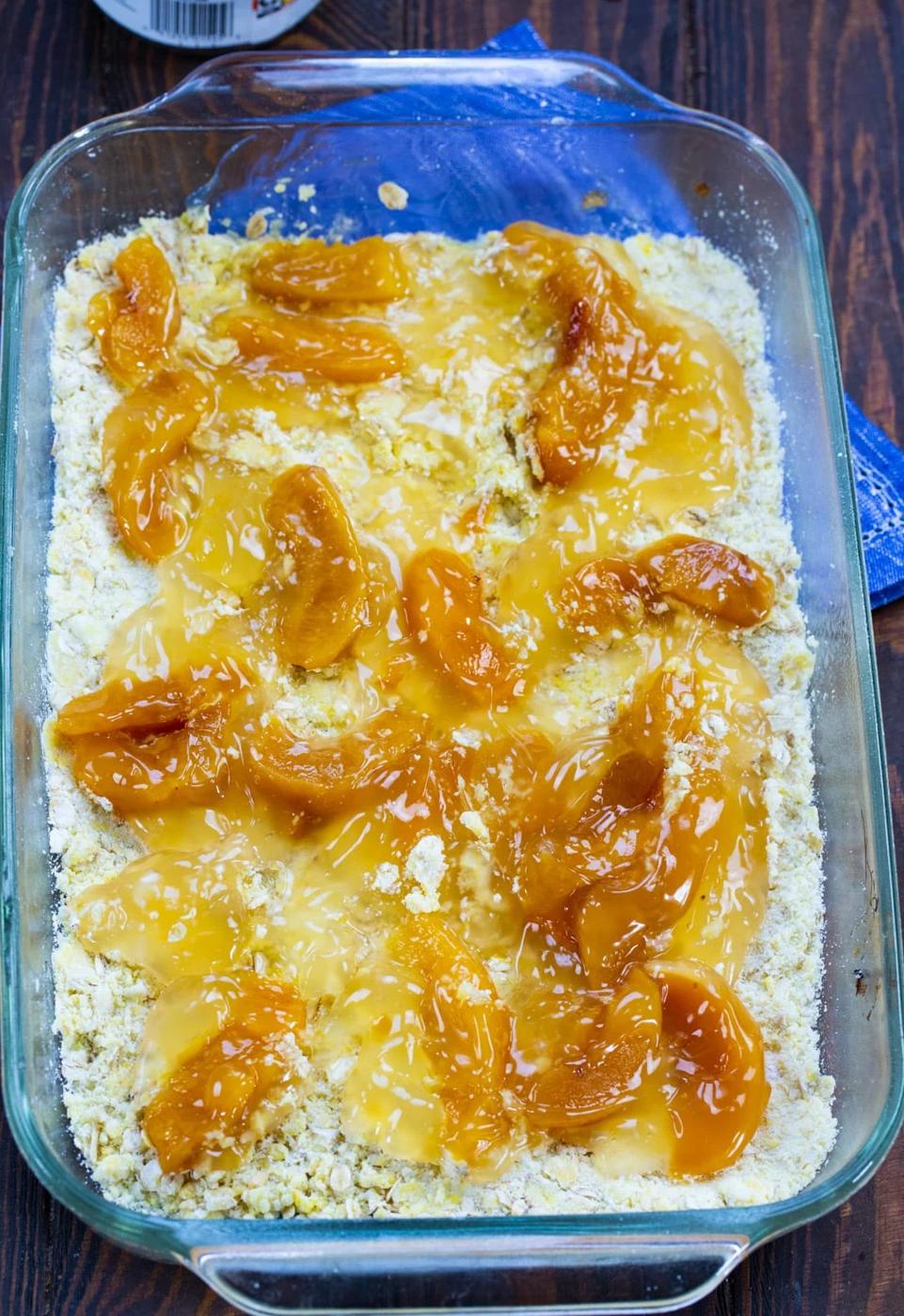 Peaches spread on top of crust.