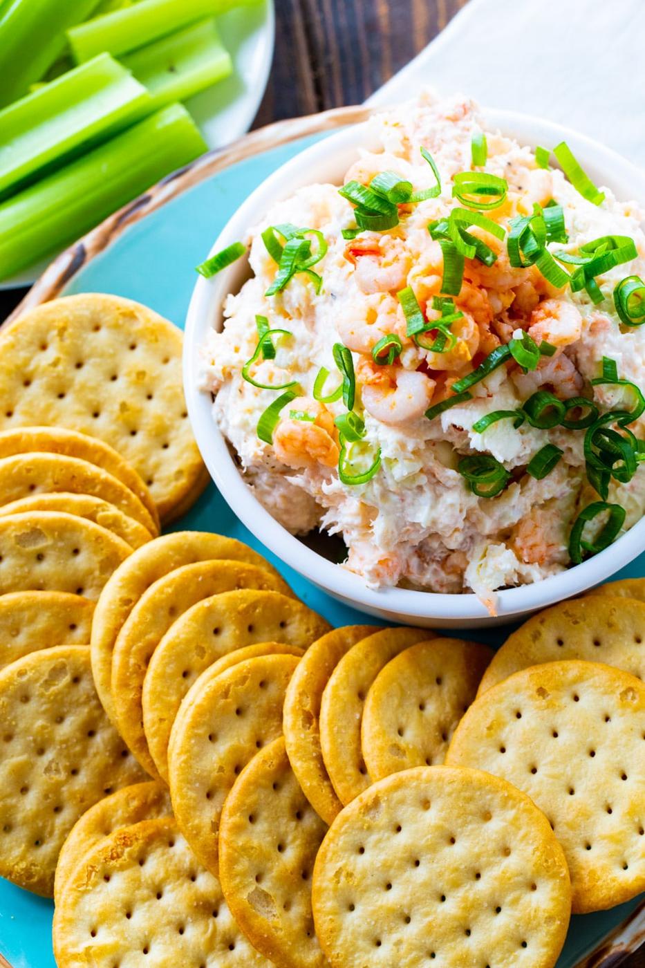 Shrimp Spread in a bowl surrounded by crackers.