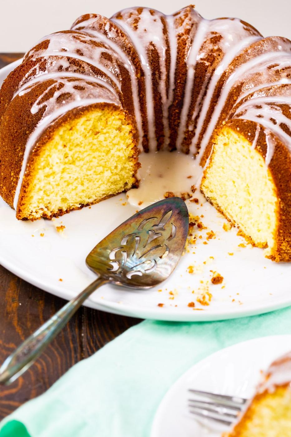 Pound Cake with pieces cut out on a plate.