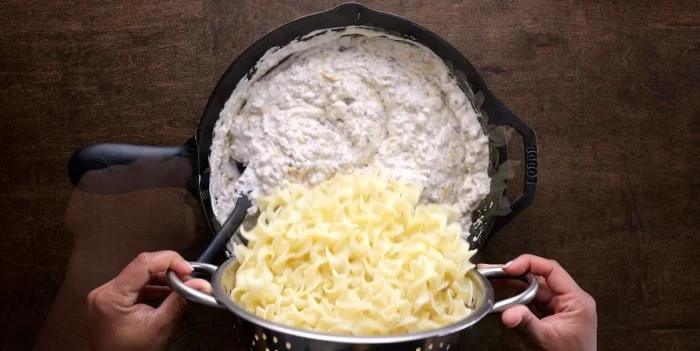 Adding the noodles.