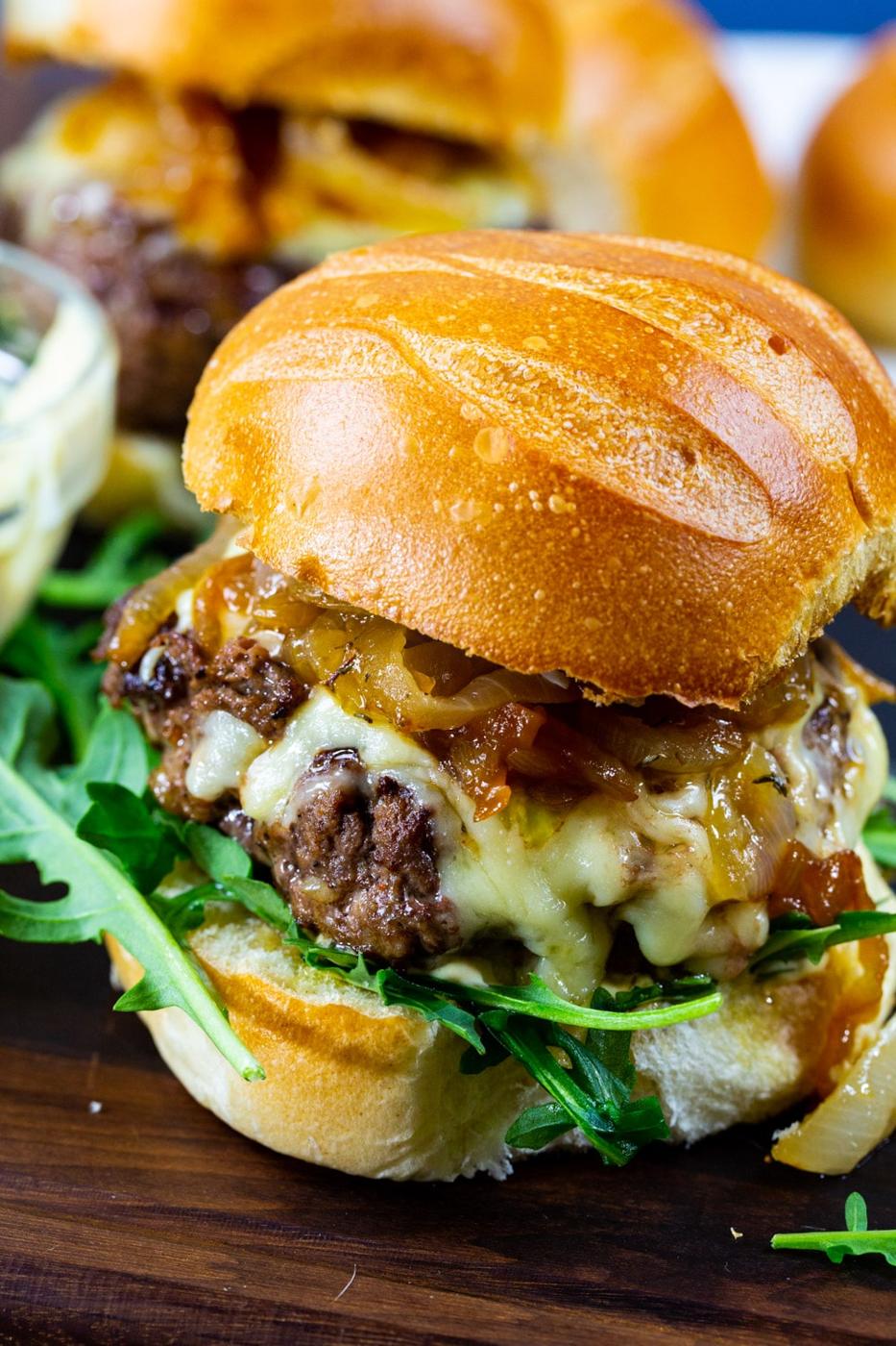 Close-up of French Onion Burgers on brioche bun.